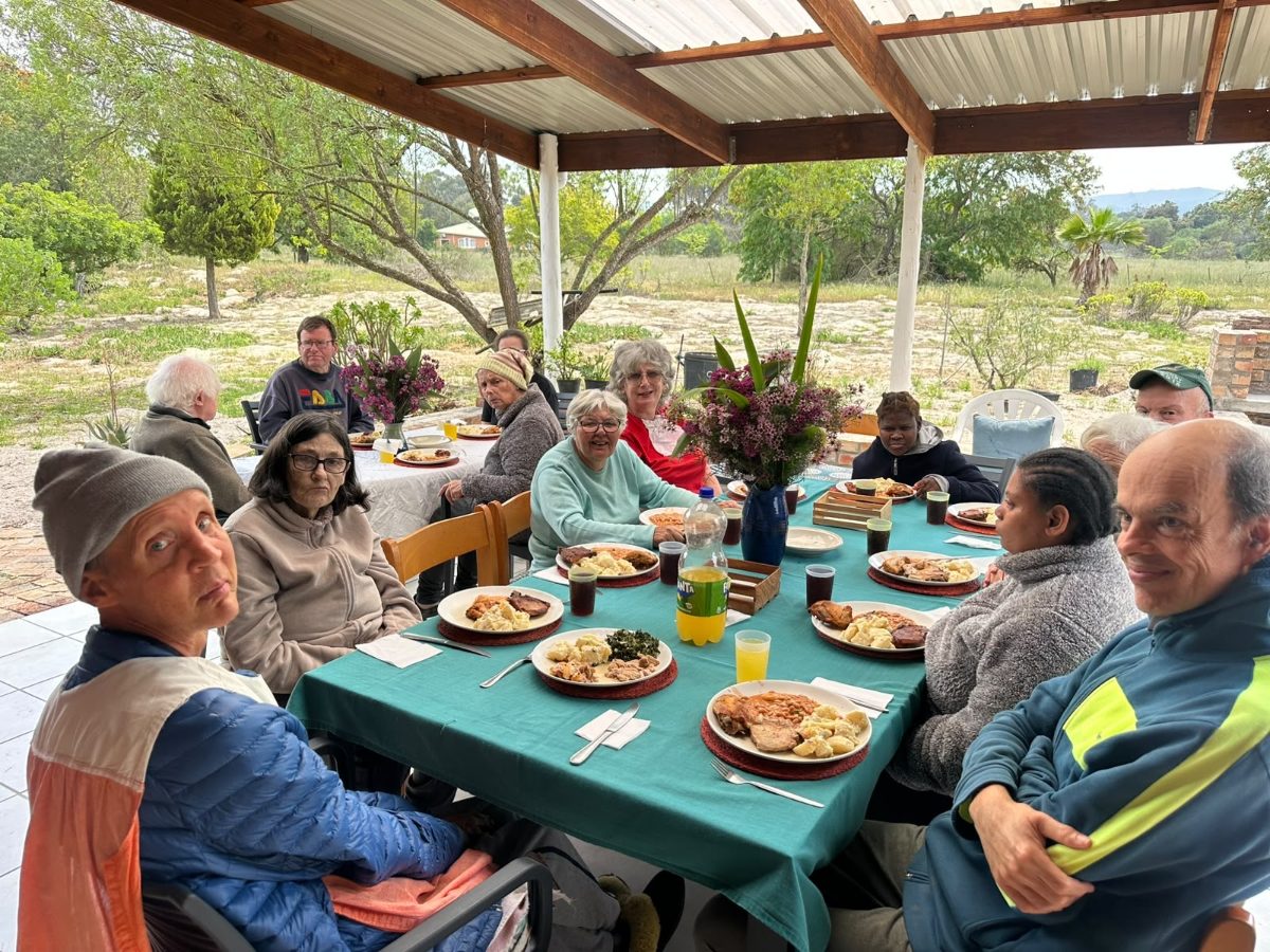 Care house residents having a heritage day braai meal